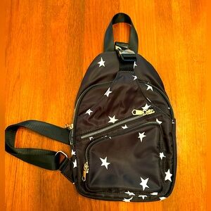 Sol and Selene Black Sling Backpack Star Gold Hardware